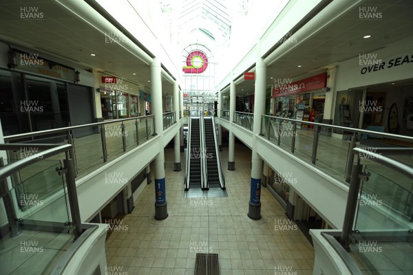 230320 - Coronavirus Outbreak - General views of a deserted Queens Arcade in Cardiff City centre during Monday morning