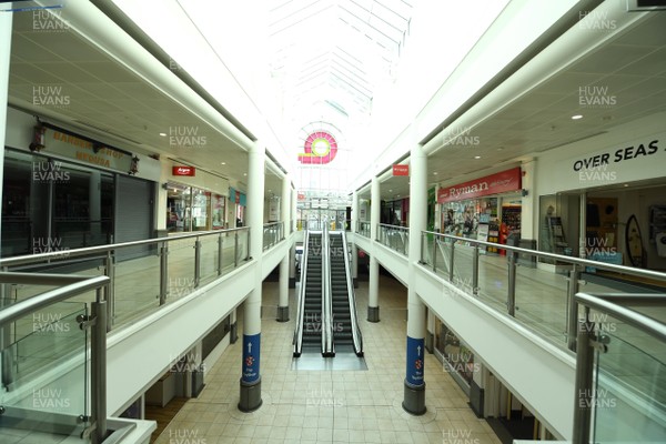 230320 - Coronavirus Outbreak - General views of a deserted Queens Arcade in Cardiff City centre during Monday morning
