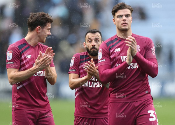 010424 - Coventry City v Cardiff City - Sky Bet Championship - Ollie Tanner of Cardiff and Manolis Siopis of Cardiff and Callum O'Dowda of Cardiff applaud the travelling fans