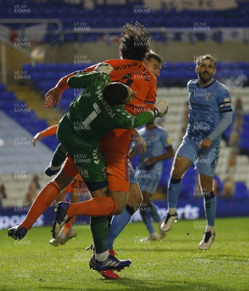 201020 - Coventry City v Cardiff City - Sky Bet Championship - Goalkeeper Marko Marosi of Coventry City and Sean Morrison of Cardiff go up for the ball in the 2nd half Goalkeeper Marko Marosi of Coventry City is taken off injured after this incident