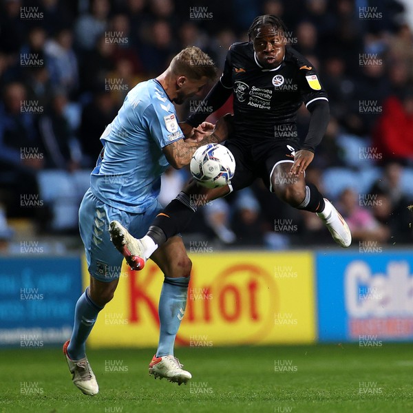021121 - Coventry City v Swansea City - SkyBet Championship - Michael Obafemi of Swansea City is challenged by Kyle McFadzean of Coventry City