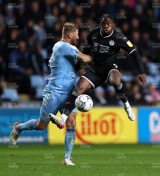 021121 - Coventry City v Swansea City - SkyBet Championship - Michael Obafemi of Swansea City is challenged by Kyle McFadzean of Coventry City