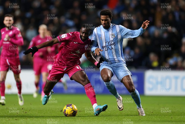291223 - Coventry City v Swansea City - SkyBet Championship - Yannick Bolasie of Swansea is challenged by Haji Wright of Coventry 