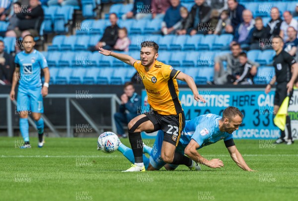 190817 - Coventry City v Newport County - Sky Bet League 2 - Newport County defender Reece Cole (22) is brough down by Coventry City midfielder Liam Kelly (6)