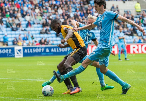 190817 - Coventry City v Newport County - Sky Bet League 2 - Newport County forward Frank Nouble (10) and Coventry City midfielder Peter Vincenti (7) challenge for a loose ball