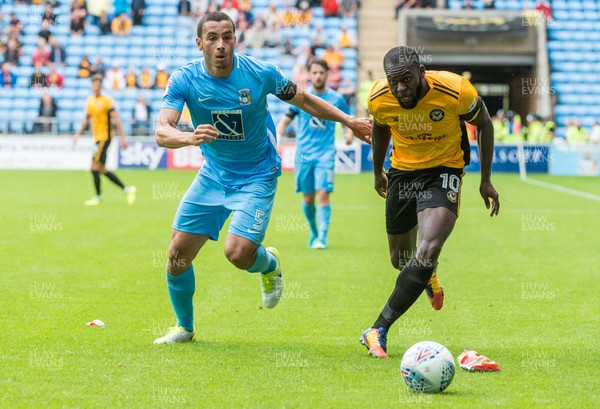 190817 - Coventry City v Newport County - Sky Bet League 2 - Coventry City defender Rod McDonald (5) and Newport County forward Frank Nouble (10) chase a loose ball