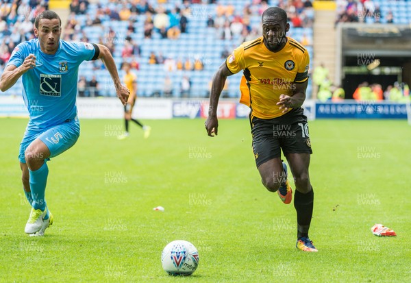 190817 - Coventry City v Newport County - Sky Bet League 2 - Coventry City defender Rod McDonald (5) and Newport County forward Frank Nouble (10) chase a loose ball