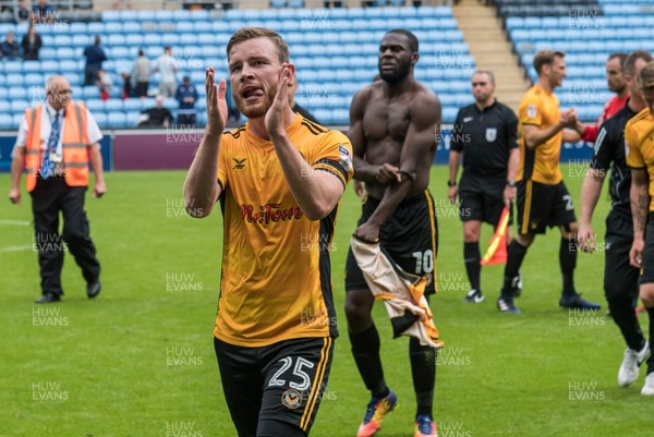 190817 - Coventry City v Newport County - Sky Bet League 2 - Newport County defender Mark O'Brien (25) applauds the traveling fans after the 1-0 away win at Coventry City