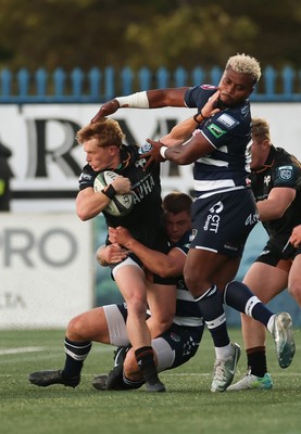 040926 - Coventry RFC v Ospreys, Pre-season Friendly - Harri Houston of Ospreys hands off Api Bavadra of Coventry