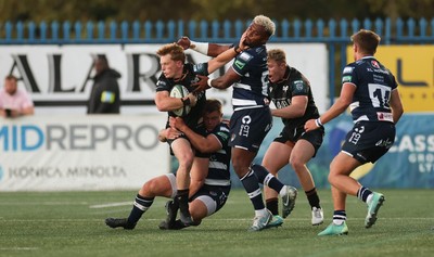 040926 - Coventry RFC v Ospreys, Pre-season Friendly - Harri Houston of Ospreys hands off Api Bavadra of Coventry