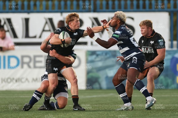 040926 - Coventry RFC v Ospreys, Pre-season Friendly - Harri Houston of Ospreys hands off Api Bavadra of Coventry
