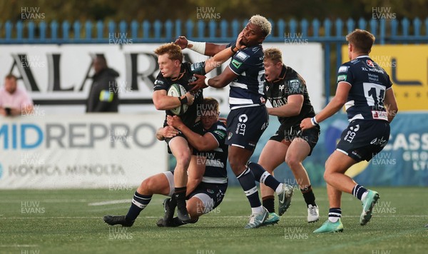 040926 - Coventry RFC v Ospreys, Pre-season Friendly - Harri Houston of Ospreys hands off Api Bavadra of Coventry
