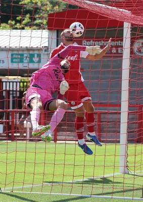 080825 - Crawley Town v Newport County, EFL Sky Bet League 2 - Crawley Town goalkeeper Harvey Davies and Charlie Barker of Crawley Town combine to prevent an early Newport goal