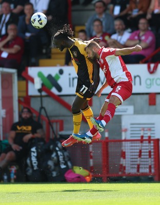 080825 - Crawley Town v Newport County, EFL Sky Bet League 2 - Cameron Antwi of Newport County and Charlie Barker of Crawley Town compete for the ball