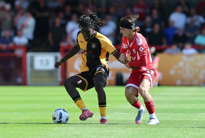 080825 - Crawley Town v Newport County, EFL Sky Bet League 2 - Michael Reindorf of Newport County and Kyle Scott of Crawley Town compete for the ball