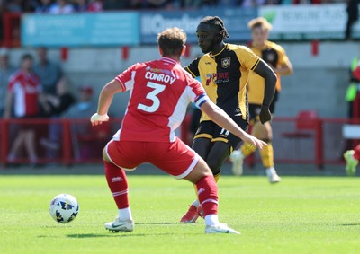 080825 - Crawley Town v Newport County, EFL Sky Bet League 2 - Cameron Antwi of Newport County takes on Dion Conroy of Crawley Town