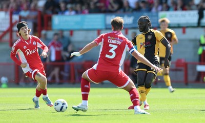 080825 - Crawley Town v Newport County, EFL Sky Bet League 2 - Cameron Antwi of Newport County takes on Dion Conroy of Crawley Town