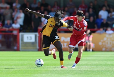 080825 - Crawley Town v Newport County, EFL Sky Bet League 2 - Michael Reindorf of Newport County and Kyle Scott of Crawley Town compete for the ball