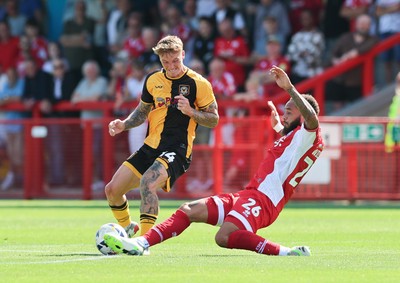 080825 - Crawley Town v Newport County, EFL Sky Bet League 2 - Kai Whitmore of Newport County is challenged by Jay Williams of Crawley Town