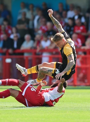 080825 - Crawley Town v Newport County, EFL Sky Bet League 2 - Kai Whitmore of Newport County is challenged by Jay Williams of Crawley Town