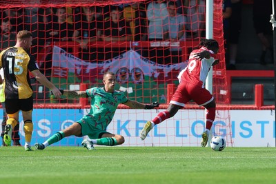 080825 - Crawley Town v Newport County, EFL Sky Bet League 2 - Kabongo Tshimanga of Crawley Town misses a chance to beat Newport County goalkeeper Nik Tzanev