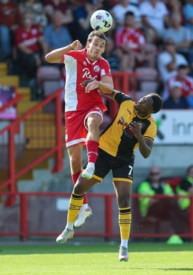 080825 - Crawley Town v Newport County, EFL Sky Bet League 2 - Josh Flint of Crawley Town and Bobby Kamwa of Newport County compete for the ball