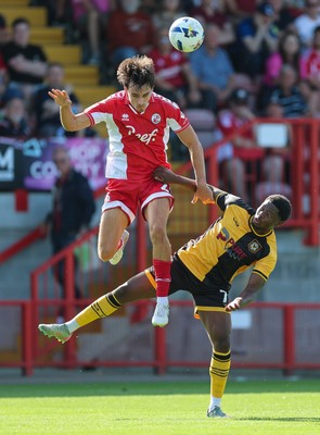 080825 - Crawley Town v Newport County, EFL Sky Bet League 2 - Josh Flint of Crawley Town and Bobby Kamwa of Newport County compete for the ball