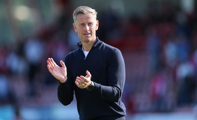 080825 - Crawley Town v Newport County, EFL Sky Bet League 2 - Newport County head coach David Hughes applauds the fans at the end of the match