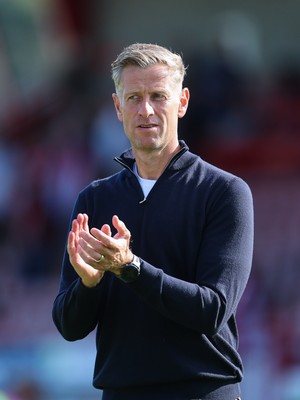 080825 - Crawley Town v Newport County, EFL Sky Bet League 2 - Newport County head coach David Hughes applauds the fans at the end of the match