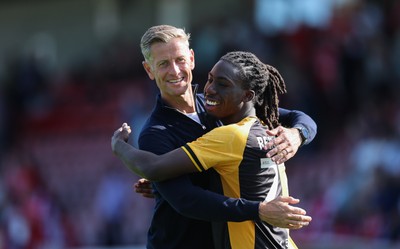 080825 - Crawley Town v Newport County, EFL Sky Bet League 2 - Newport County head coach David Hughes celebrates with Michael Reindorf of Newport County at the end of the match