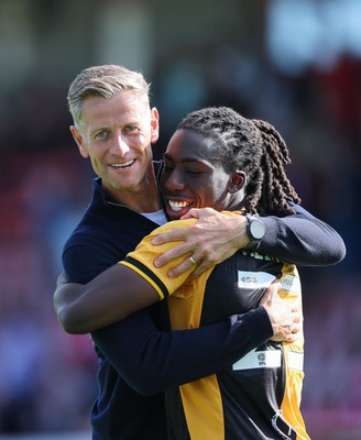080825 - Crawley Town v Newport County, EFL Sky Bet League 2 - Newport County head coach David Hughes celebrates with Michael Reindorf of Newport County at the end of the match