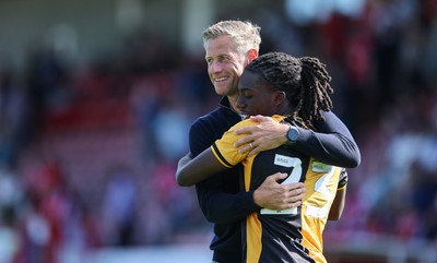 080825 - Crawley Town v Newport County, EFL Sky Bet League 2 - Newport County head coach David Hughes celebrates with Michael Reindorf of Newport County at the end of the match