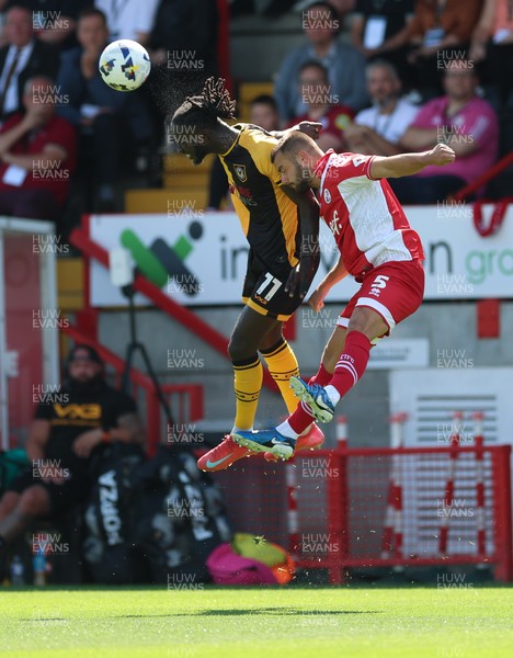 080825 - Crawley Town v Newport County, EFL Sky Bet League 2 - Cameron Antwi of Newport County and Charlie Barker of Crawley Town compete for the ball