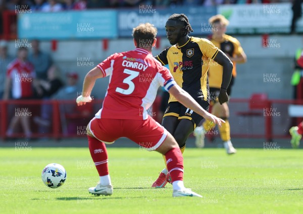 080825 - Crawley Town v Newport County, EFL Sky Bet League 2 - Cameron Antwi of Newport County takes on Dion Conroy of Crawley Town