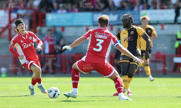 080825 - Crawley Town v Newport County, EFL Sky Bet League 2 - Cameron Antwi of Newport County takes on Dion Conroy of Crawley Town