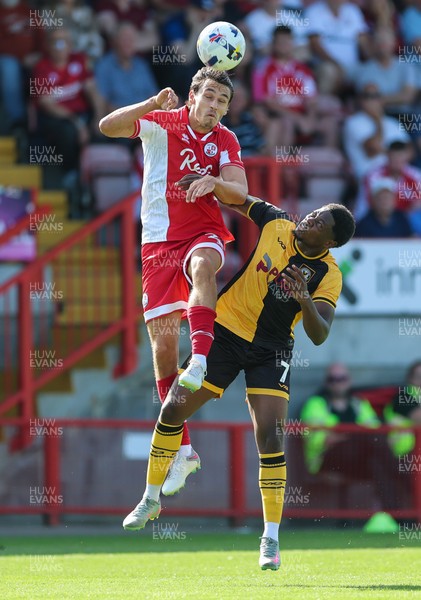 080825 - Crawley Town v Newport County, EFL Sky Bet League 2 - Josh Flint of Crawley Town and Bobby Kamwa of Newport County compete for the ball