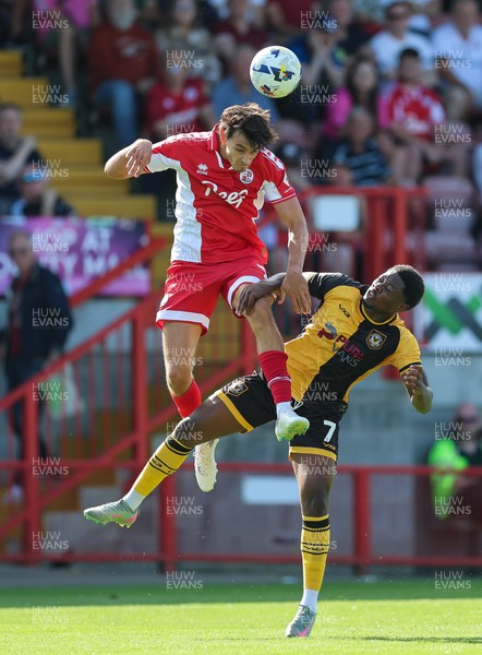 080825 - Crawley Town v Newport County, EFL Sky Bet League 2 - Josh Flint of Crawley Town and Bobby Kamwa of Newport County compete for the ball