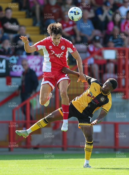 080825 - Crawley Town v Newport County, EFL Sky Bet League 2 - Josh Flint of Crawley Town and Bobby Kamwa of Newport County compete for the ball