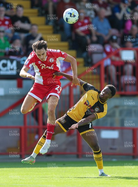 080825 - Crawley Town v Newport County, EFL Sky Bet League 2 - Josh Flint of Crawley Town and Bobby Kamwa of Newport County compete for the ball