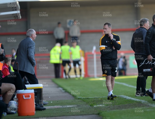 201018  Crawley Town v Newport County - Sky Bet League 2 -   Newport manager Michael Flynn has a word with his bench 