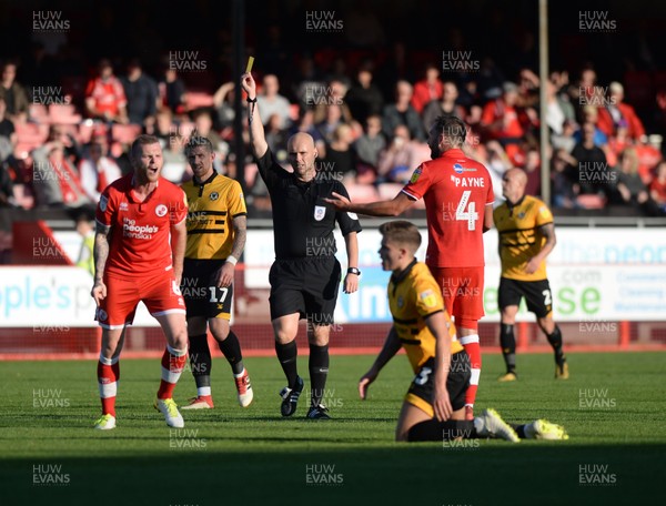 201018  Crawley Town v Newport County - Sky Bet League 2 -   Crawley's Mark Connolly is booked for a foul and complains to the Newport player for faking 