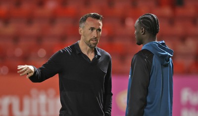 101225 - Crewe Alexandra v Newport County - Sky Bet League 2 - Newport manager Christian Fuchs talks to Nathan Opoku of Newport before the match