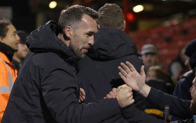 101225 - Crewe Alexandra v Newport County - Sky Bet League 2 - Fans hug Newport manager Christian Fuchs at the end of the match
