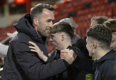 101225 - Crewe Alexandra v Newport County - Sky Bet League 2 - Fans hug Newport manager Christian Fuchs at the end of the match