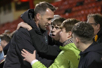 101225 - Crewe Alexandra v Newport County - Sky Bet League 2 - Fans hug Newport manager Christian Fuchs at the end of the match