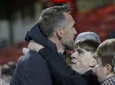 101225 - Crewe Alexandra v Newport County - Sky Bet League 2 - Fans hug Newport manager Christian Fuchs at the end of the match