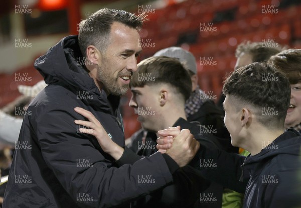 101225 - Crewe Alexandra v Newport County - Sky Bet League 2 - Fans hug Newport manager Christian Fuchs at the end of the match