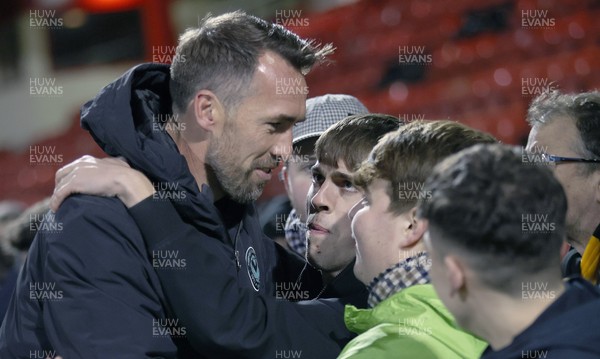 101225 - Crewe Alexandra v Newport County - Sky Bet League 2 - Fans hug Newport manager Christian Fuchs at the end of the match