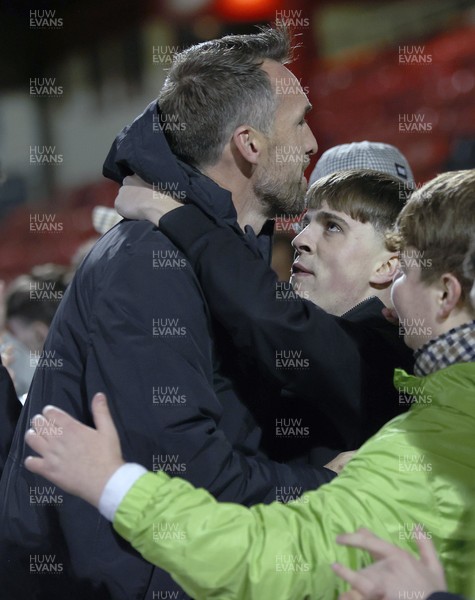 101225 - Crewe Alexandra v Newport County - Sky Bet League 2 - Fans hug Newport manager Christian Fuchs at the end of the match