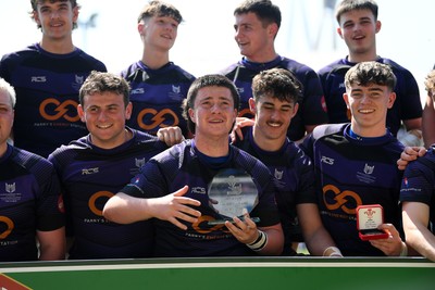 270426 - Crickhowell v Haverfordwest High - Road to Principality Finals - Boys U18s Vase - Haverfordwest players celebrate lifting the vase at full time